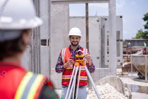 Preview: Engineer or worker construction architecture wear safety uniform and helmet with equipment theodolit