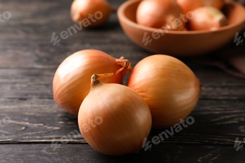 Preview: Ripe fresh onion on wooden background, close up