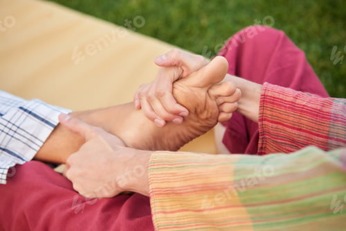 Preview: Close up hands massaging foot.