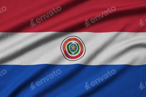 Preview: Paraguay flag is depicted on a sports cloth fabric with many folds. Sport team waving banner