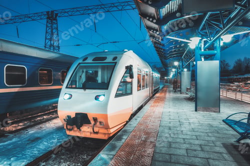 Preview: White high speed train on the railway station at night