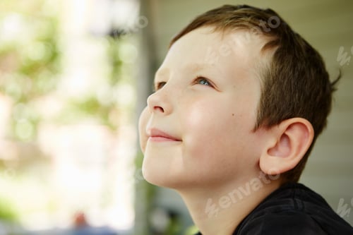 Preview: Close up profile portrait of boy in forest