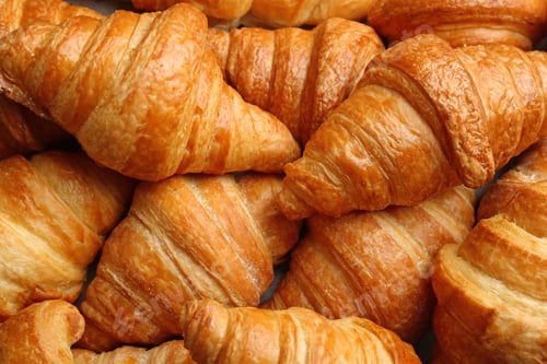 Preview: Fresh tasty croissants as background, closeup. French pastry