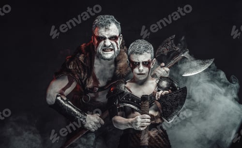 Preview: Posing together warlike father and son in dark background