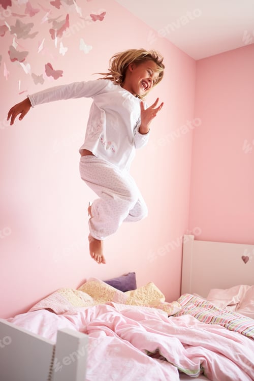 Preview: Young Girl Jumping On Her Bed