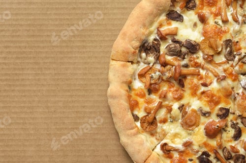 Preview: Pizza with mushrooms on corrugated fiberboard background.