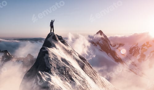 Preview: Adventurous Man is taking in the moment on top of a mountain