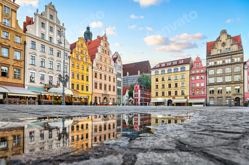 Preview: Colorful buildings reflecting in a puddle on Rynek square in Wroclaw