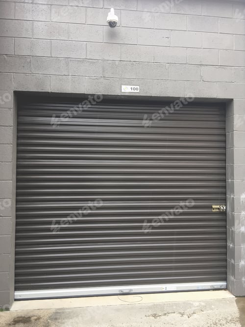 Preview: A locked storage unit with a security camera above the metal door.