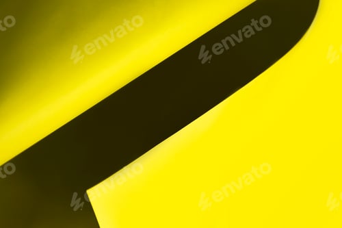 Preview: bright yellow sheet paper. Concepts: lines and geometry. defocus abstract background.