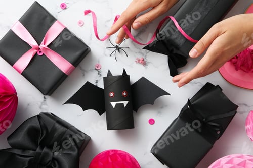 Preview: Black, paper bat with gifts for Halloween