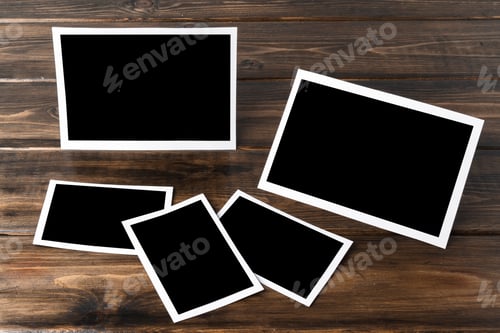Preview: Blank photo frames for your photos on wooden background
