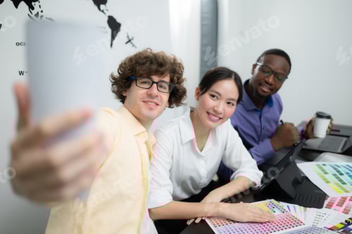 Preview: Multiethnic team of architects and designers are meeting to brainstorm design an application