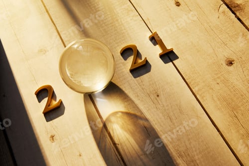 Preview: New Year 2021 Golden numbers 2021 with a crystal ball under the sunlight