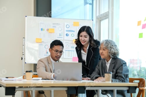 Preview: Business team analyzing income charts and graphs ,Financial Analysis with modern laptop computer