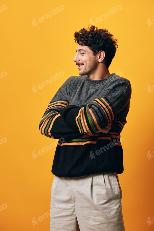 Preview: Standing man trendy male portrait happy orange fashion smile sweater background face student