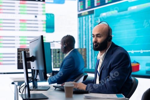 Preview: Company associate examining infographics in a organizational headquarters