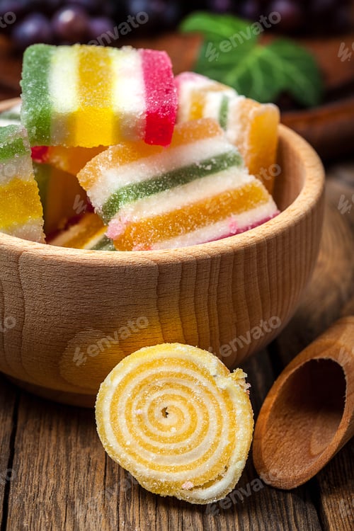Preview: Colorful jelly candies in wooden bowl.