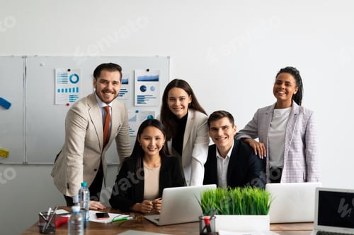 Preview: Smiling multiethnic international young professional employees company staff with older executive