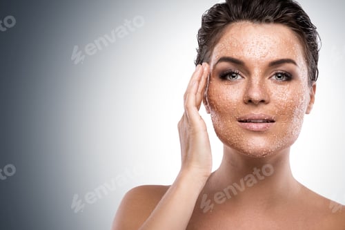 Preview: Woman Applying Facial Scrub with Hydrating Skin Effect