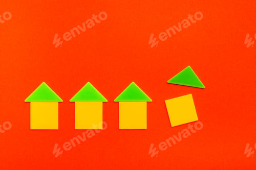 Preview: Colored houses are made up of flat squares and triangles on red cardboard.