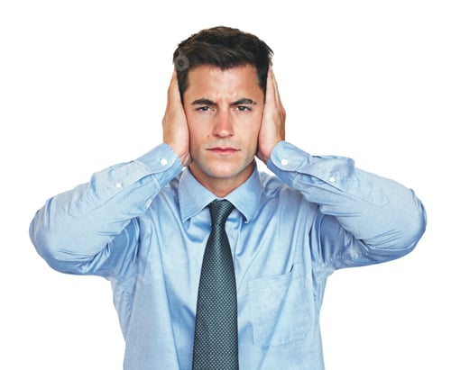 Preview: Studio portrait of a young businessman covering his ears against a white background
