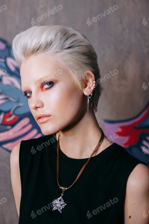 Preview: Portrait of a young fashionable blonde girl with an original hairstyle