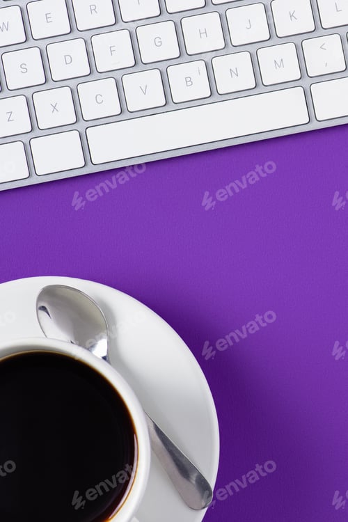 Preview: top view of workspace with computer keyboard and coffee cup