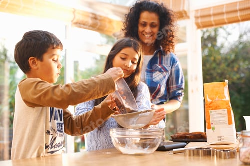 Preview: Mother and children baking in kitchen