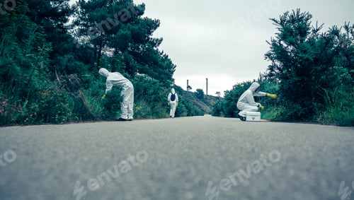 Preview: People in bacteriological protection suits looking for samples on empty road