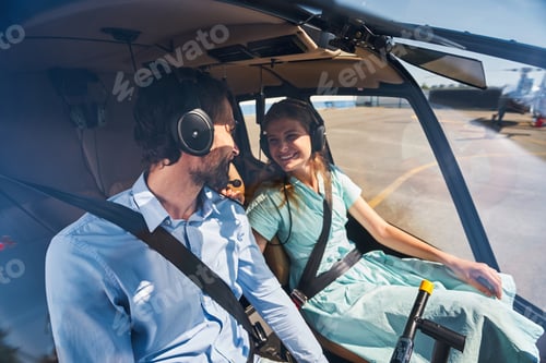 Preview: Couple seated in private chopper before take-off