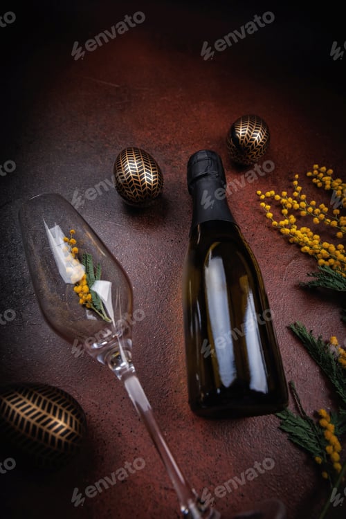 Preview: Easter holiday table with champagne and mimosa decorations