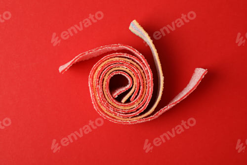 Preview: Gummy candy on red background, top view