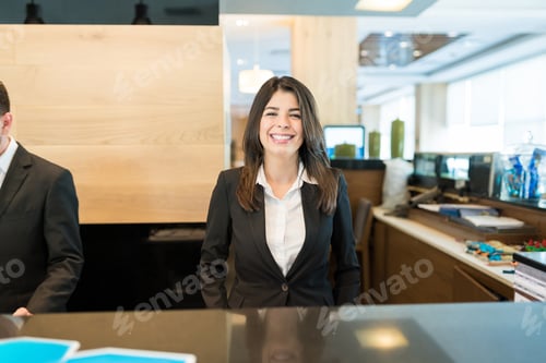 Preview: Smiling Pretty Manager At Hotel Reception