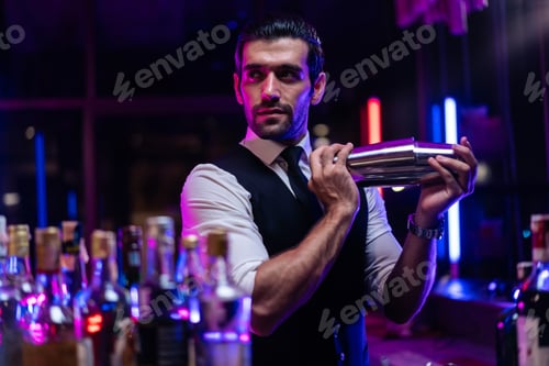 Preview: Caucasian profession bartender making a cocktail for women at a bar.