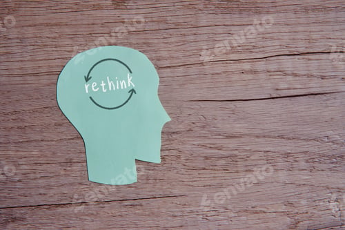 Preview: A conceptual image with the word "rethink" written across a paper cutout head.
