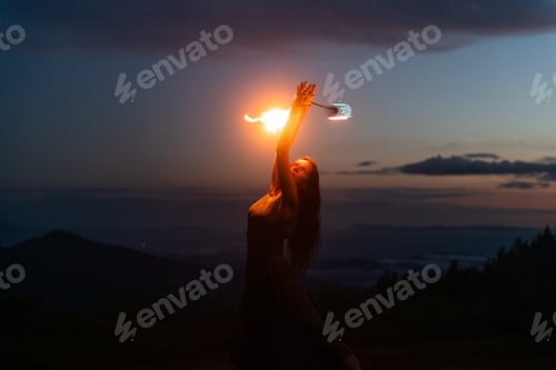 Preview: Graceful elegant red haired female fireshow performer