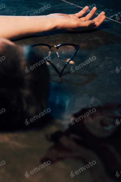 Preview: partial view of dead man on floor at crime scene