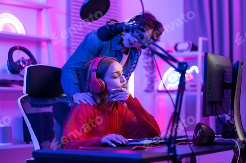 Preview: Caucasian Esport couple gamer playing online video game on computer.