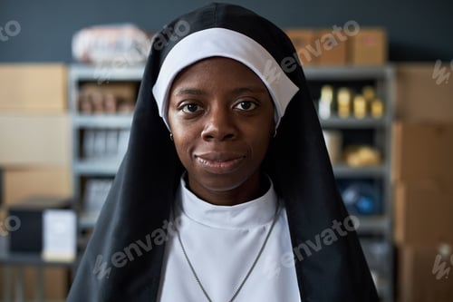 Preview: Portrait of Black Nun Staring Intently at Camera