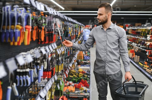 Preview: male builder in a hardware store