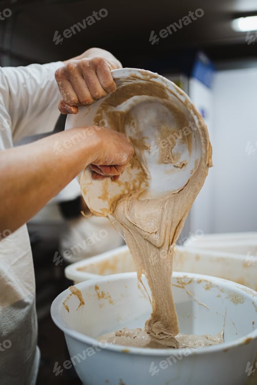 Preview: Baker moving liquid fresh bread dough starter