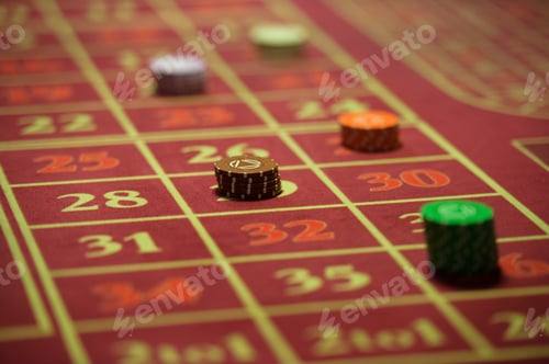 Preview: close-up of casino chips on the red table