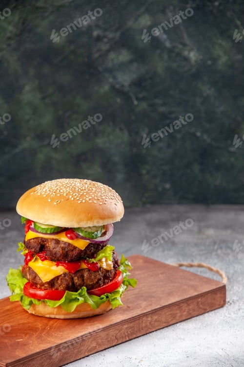 Preview: Homemade tasty sandwich on wooden cutting board on blurred background