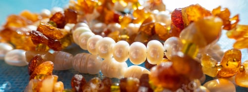 Preview: Sunny beads of amber pearl lapis lazuli on blue backgroung.