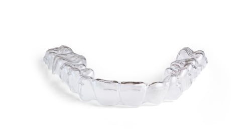 Preview: Invisible braces lying on a white background representing modern orthodontics