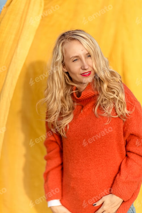 Preview: blonde girl in a red sweater portrait