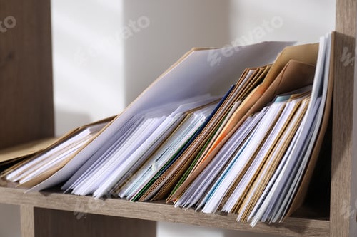Preview: Different paper envelopes on wooden shelf in post office, closeup