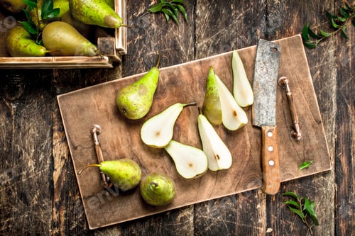 Preview: Slicing ripe pears on a cutting board.