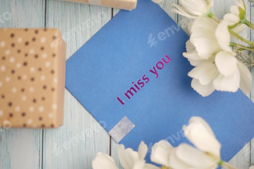 Preview: Messages written on colorful cards placed among flowers
